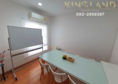 Modern meeting room with air conditioning, whiteboard, and glass table