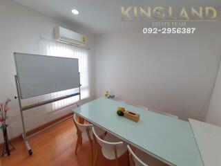 Modern meeting room with air conditioning, whiteboard, and glass table