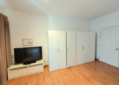 Bedroom with wardrobe and TV