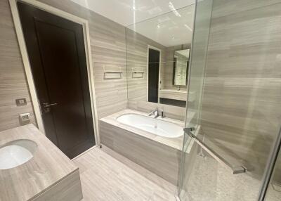 Modern bathroom with bathtub and glass shower