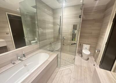 Spacious Bathroom with Glass-Enclosed Shower and Bathtub