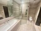 Spacious Bathroom with Glass-Enclosed Shower and Bathtub