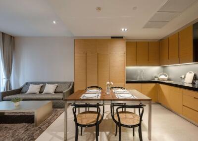 Modern living and kitchen area with dining table