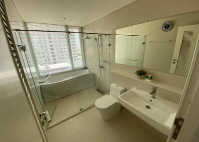 Modern bathroom with large bathtub and glass shower