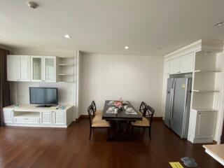 Living room with dining table and TV unit