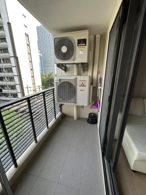 Apartment balcony with view of adjacent buildings