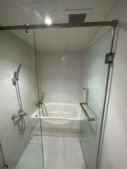 Modern bathroom with glass shower and bathtub