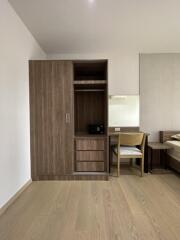 Bedroom with wooden wardrobe and study desk