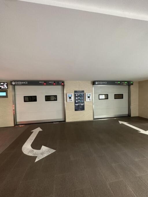 Parking garage entrance with two roller shutters