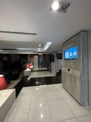 Modern building entrance lobby with digital directory