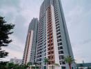 Modern high-rise residential building with swimming pool