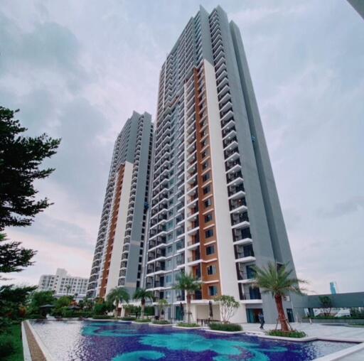 Modern high-rise residential building with swimming pool