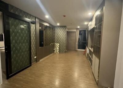 Modern hallway with wooden flooring and decorative wall panels