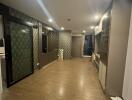 Modern hallway with wooden flooring and decorative wall panels