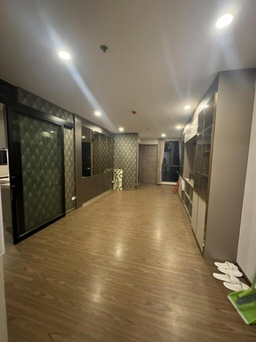 Modern hallway with wooden flooring and decorative wall panels