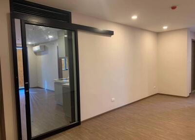 Modern main living area with sliding glass door and recessed lighting