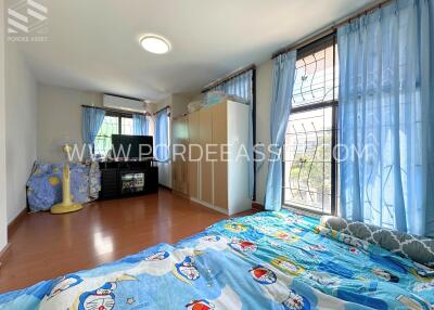 Bright and airy bedroom with large windows