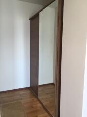 Bedroom with mirrored sliding door wardrobe