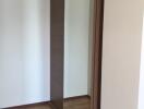 Bedroom with mirrored sliding door wardrobe