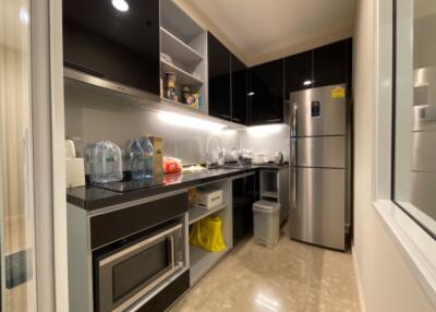 Modern kitchen with stainless steel appliances and granite countertops