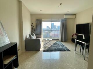 Spacious living room with modern furnishings and large window