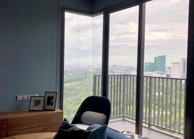 Modern living room with large windows and city view