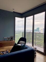 Modern living room with large windows and city view