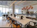 Modern kitchen with dining area and city view