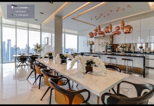 Modern kitchen with dining area and city view