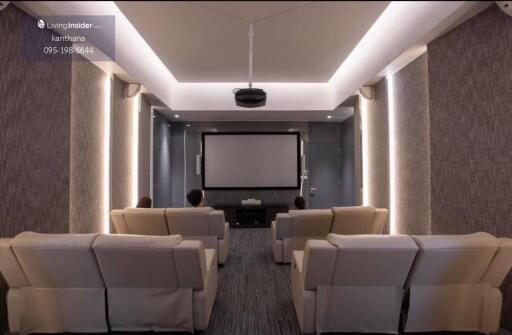 Home entertainment room with projector and seating