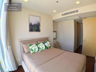 Cozy bedroom with natural light and modern decor