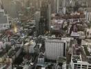 View of city skyline with numerous buildings during sunset