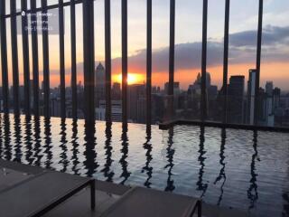 Infinity pool with city skyline view