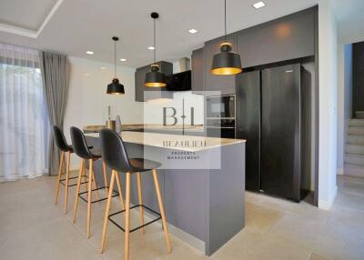 Modern kitchen with island and bar stools