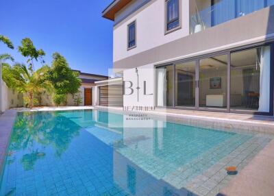 Swimming pool view with modern house