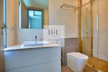 Modern bathroom with vanity, mirror, and walk-in shower