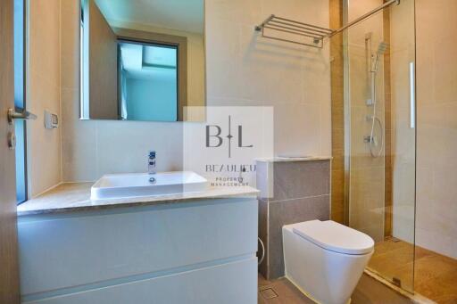 Modern bathroom with vanity, mirror, and walk-in shower