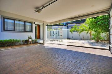 Spacious garage with access to a landscaped outdoor area