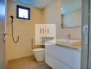 Modern bathroom with vanity, toilet, and shower