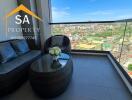 Balcony with outdoor seating and city view