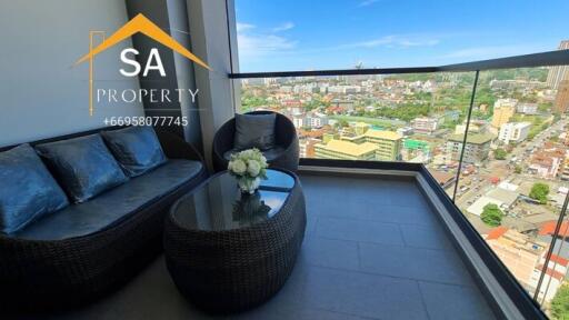 Balcony with outdoor seating and city view