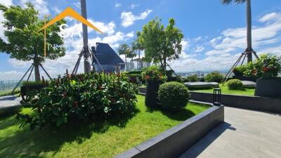 Outdoor garden with lush greenery and seating area