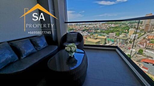 Balcony with city view and wicker furniture