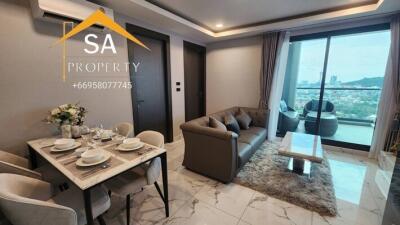 Modern living room with dining area and balcony view