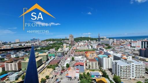 Cityscape from high-rise building with clear blue sky