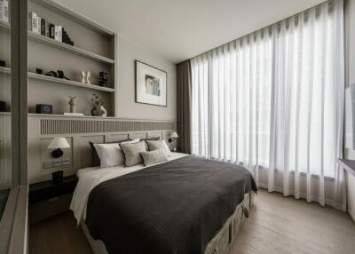 Modern bedroom with large window and neutral decor