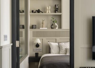 Modern bedroom with built-in shelves and stylish decor