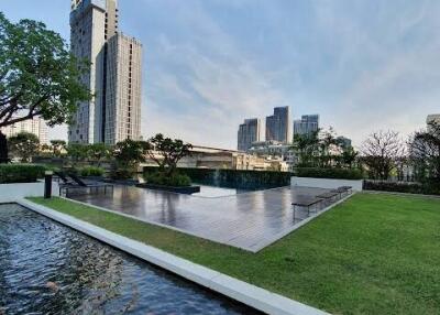 Outdoor view with modern buildings and koi pond