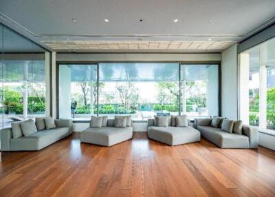 Modern living room with large windows and hardwood floors