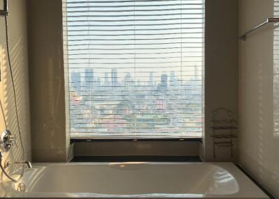 Bathroom with a large window view